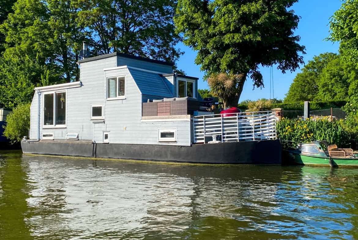 Floating home moored on the River Thames in Surrey