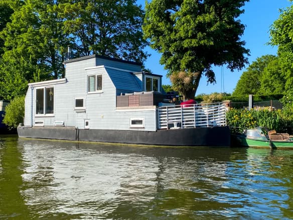 Floating home moored on the River Thames in Surrey