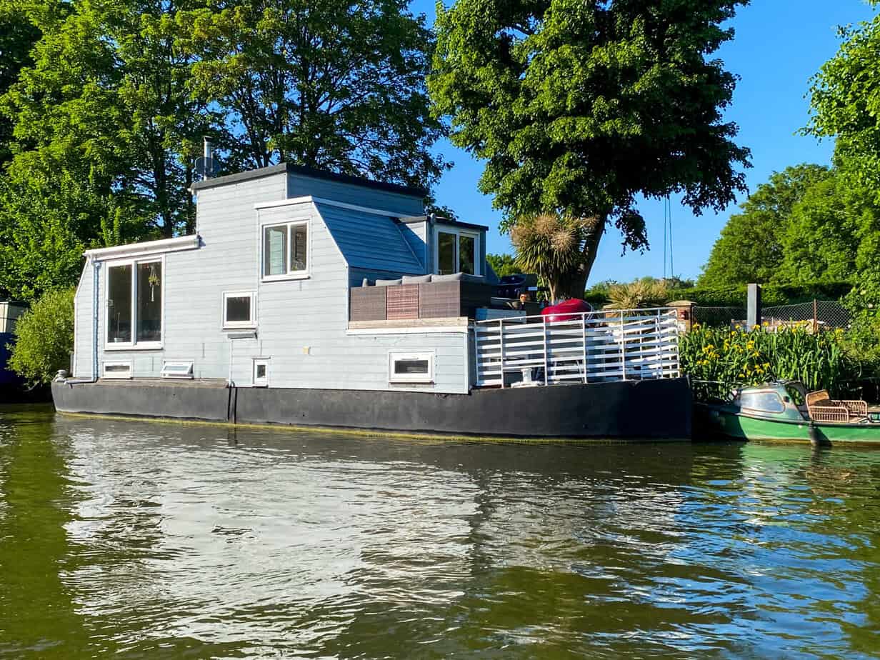 Floating home moored on the River Thames in Surrey